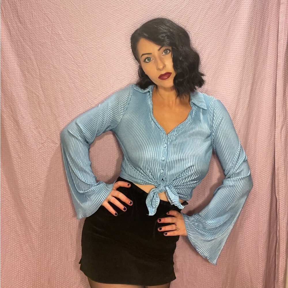 Baby blue satiny ribbed button up top with bell sleeves. New without tags 🦋